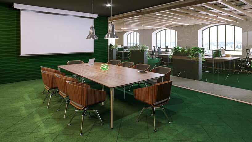 sala konferencyjna w zielonym kolorze z drewnianymi meblami