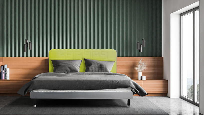 łóżko tapicerowane w kolorze jasnej zielenie oraz szarości