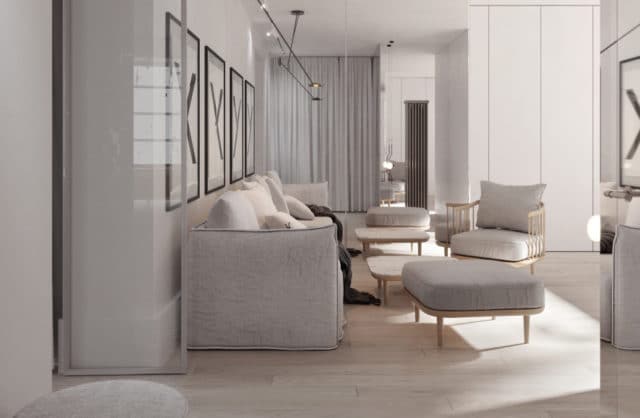 nowoczesne wnętrze salonu z jasną podłogą z szarymi ciepłymi materiałami kanap przy ścianie z ramami