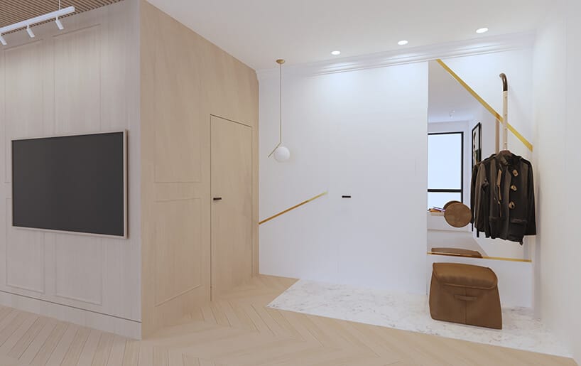 nowoczesny apartament od Sikora Wnętrza przedpokój z białą i beżową ścianą z wkomponowanymi drzwiami