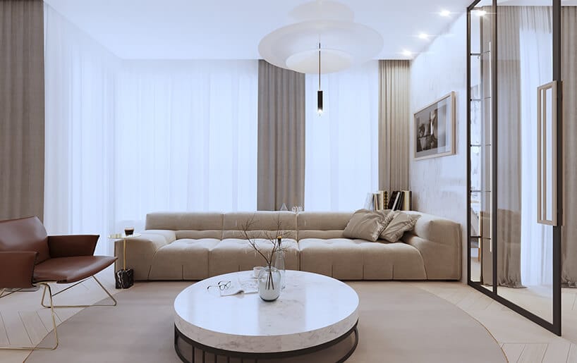 nowoczesny apartament od Sikora Wnętrza niski stolik z kamiennym blatem przed długa beżową sofą