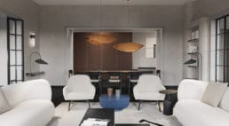 salon z betonowymi ścianami oraz jasnym umeblowaniem z otwartą przestrzenią na jadalnie