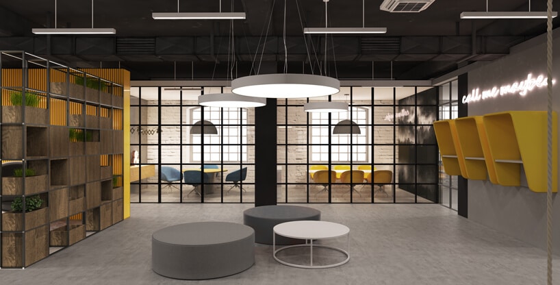 część socjalna przestrzeni biurowej z okrągłymi siedziskami i żółtymi budkami na ścianie od Consido
