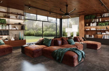 duża brązowa skórzana kanapa z zielonym kocem na kanapie oraz zielone poduszki