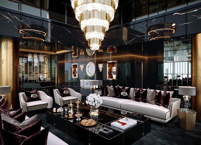 luksusowe wnętrze apartamentu w Dubaju od Covet House czarno-złoty salon z białą dużą sofą i dużym złotym żyrandolem