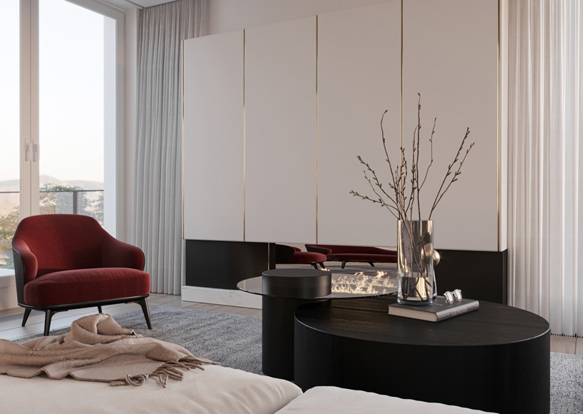 wnętrze eleganckiego apartamentu elegancki okrągły dwu poziomwy czarny stolik na tle białej zabudowy ze złotymi akcentami