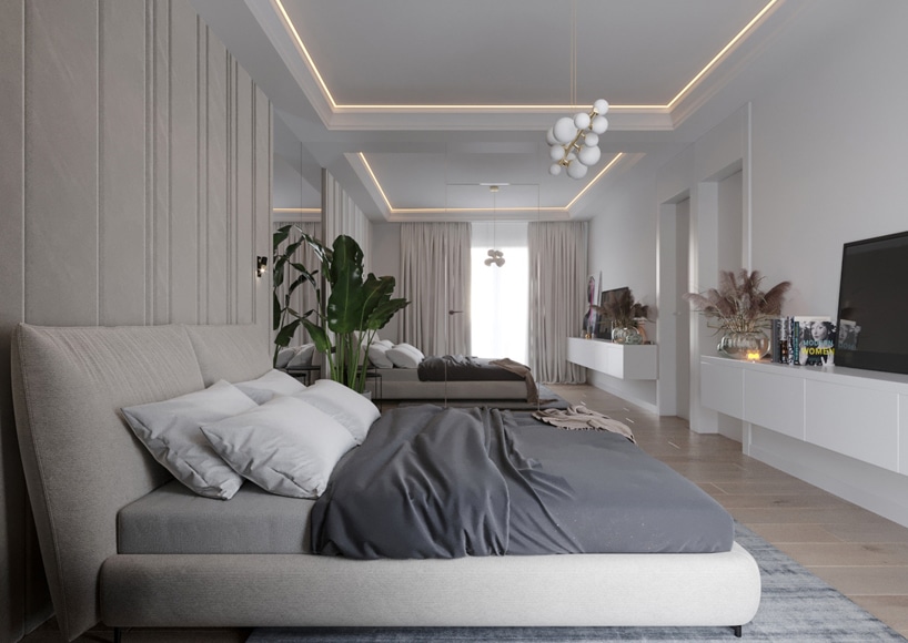wnętrze eleganckiego apartamentu biała sypialnia z szarym łózkiem z białym podwieszanym sufitem