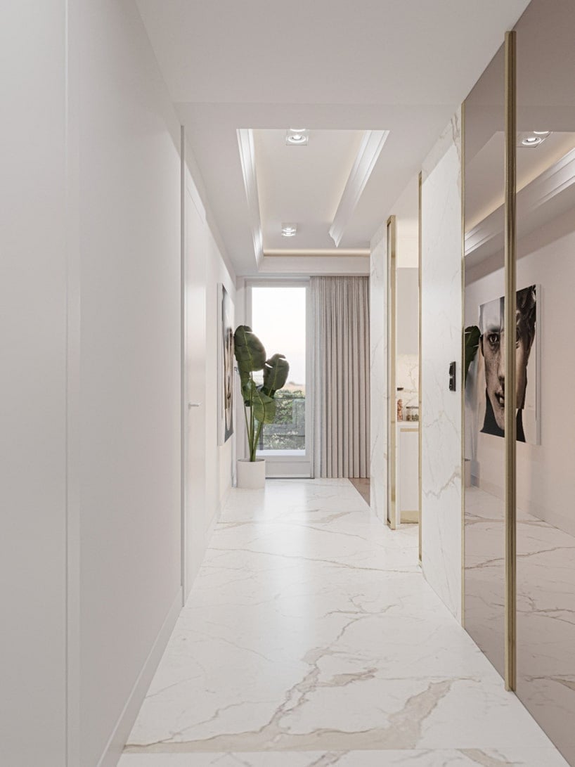 wnętrze eleganckiego apartamentu biały przedpokój z białą kamienną podłogą