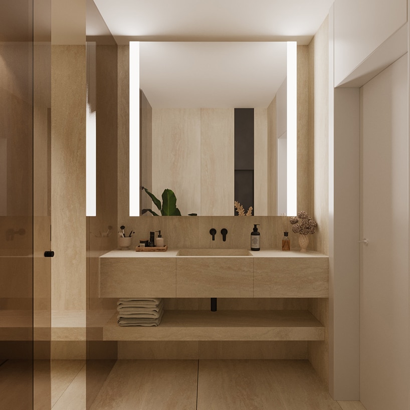 wnętrze eleganckiego apartamentu beżowa łazienka z zabudowaną umywalką i dużym lustrem
