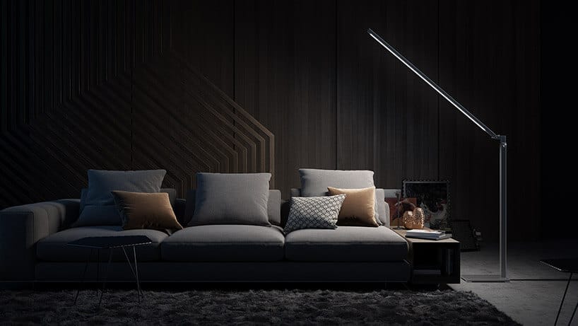 sofa z poduszkoami oświetlona wyjątkową lampą od lumeline