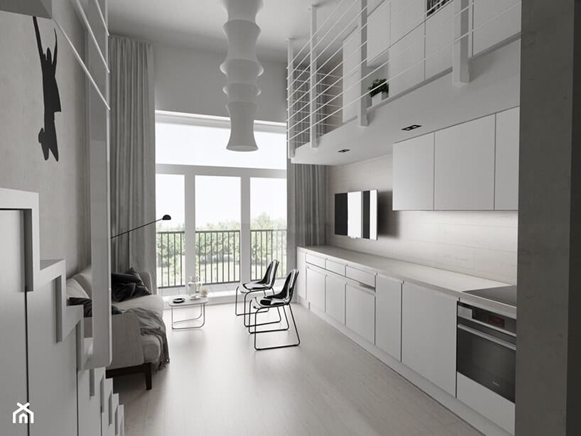 projekt minimalistycznego loftu Piotra Skorupskiego ze Studia Architektury biała kuchnia połączona z salonem